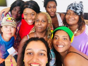 A group of women posing for the camera.