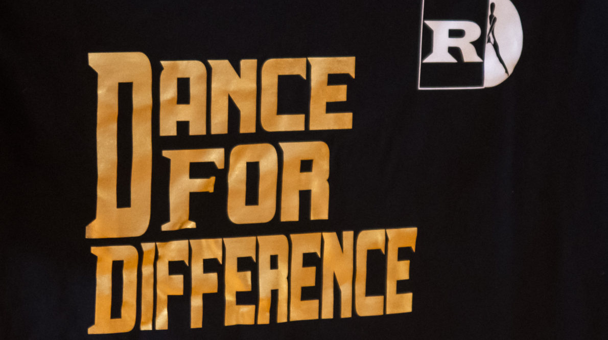 A black shirt that says dance for difference
