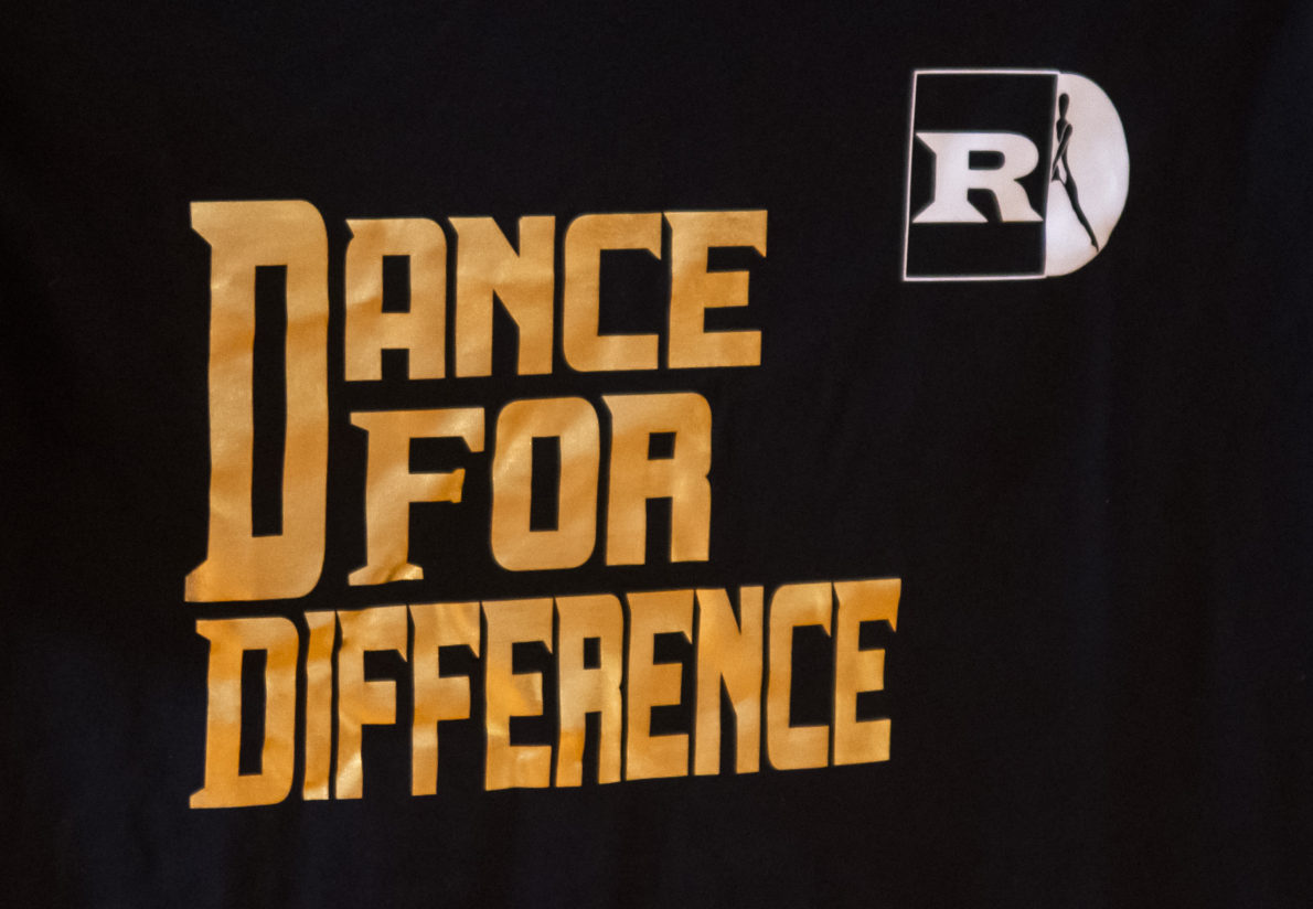 A black shirt that says dance for difference